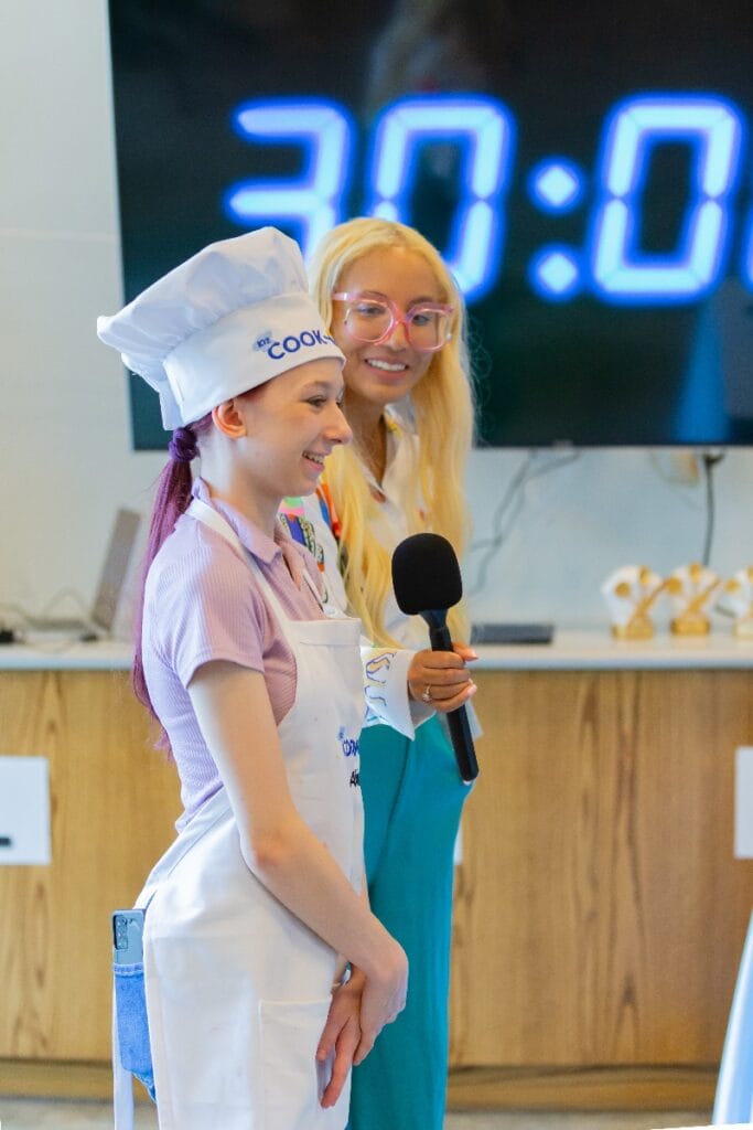 Alivia talking with a mic